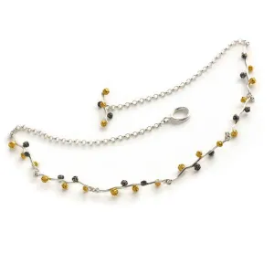 A Floral and fruit necklace design in sterling silver grains of peppercorn with three colours