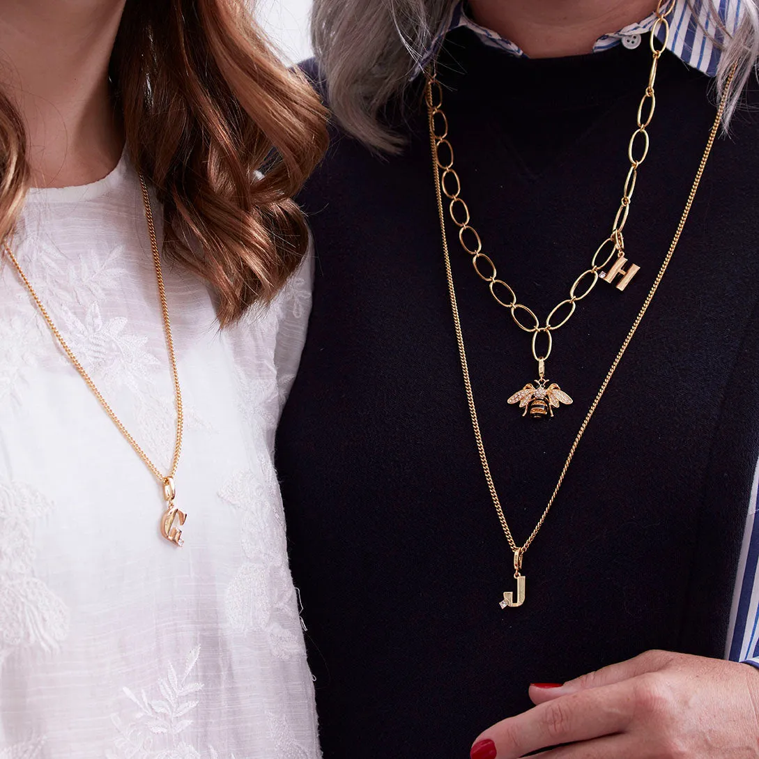 Monogram charm, A